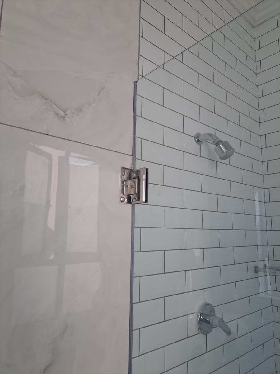 Walk-in shower with white subway tiles