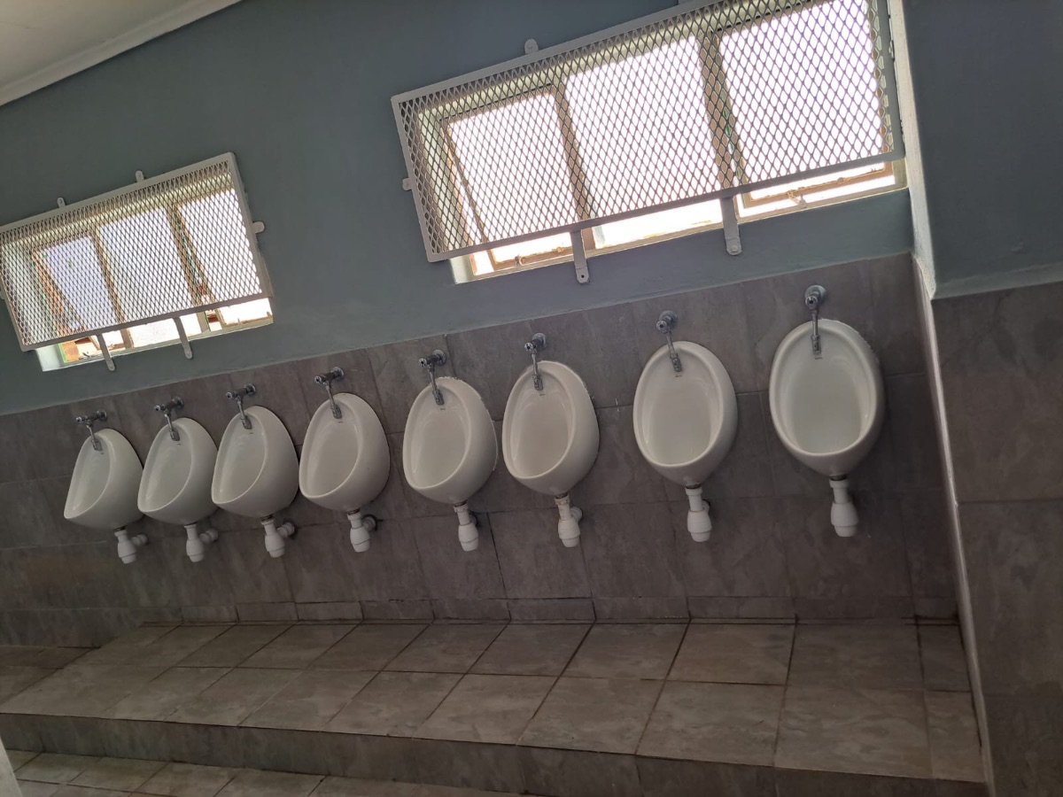 Commercial washroom with urinal block