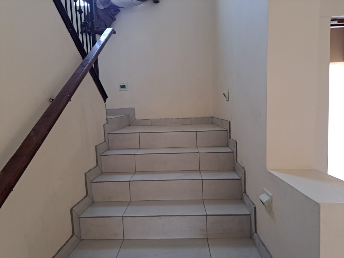 Tiled staircase with timber handrail